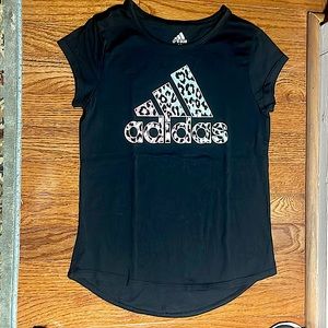 Girls adidas shirt coming in animal print with the colors pink blue and purple!